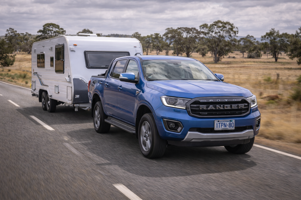 Ford Ranger towing a caravan on a regional road