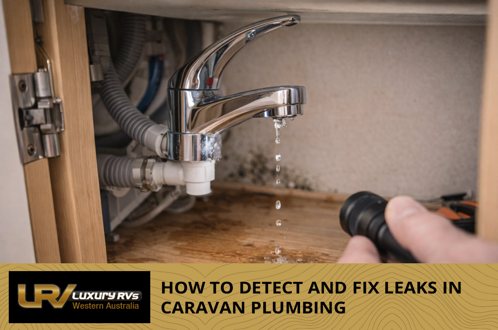 Interior of a caravan cupboard showing water damage and staining from a hidden plumbing leak.